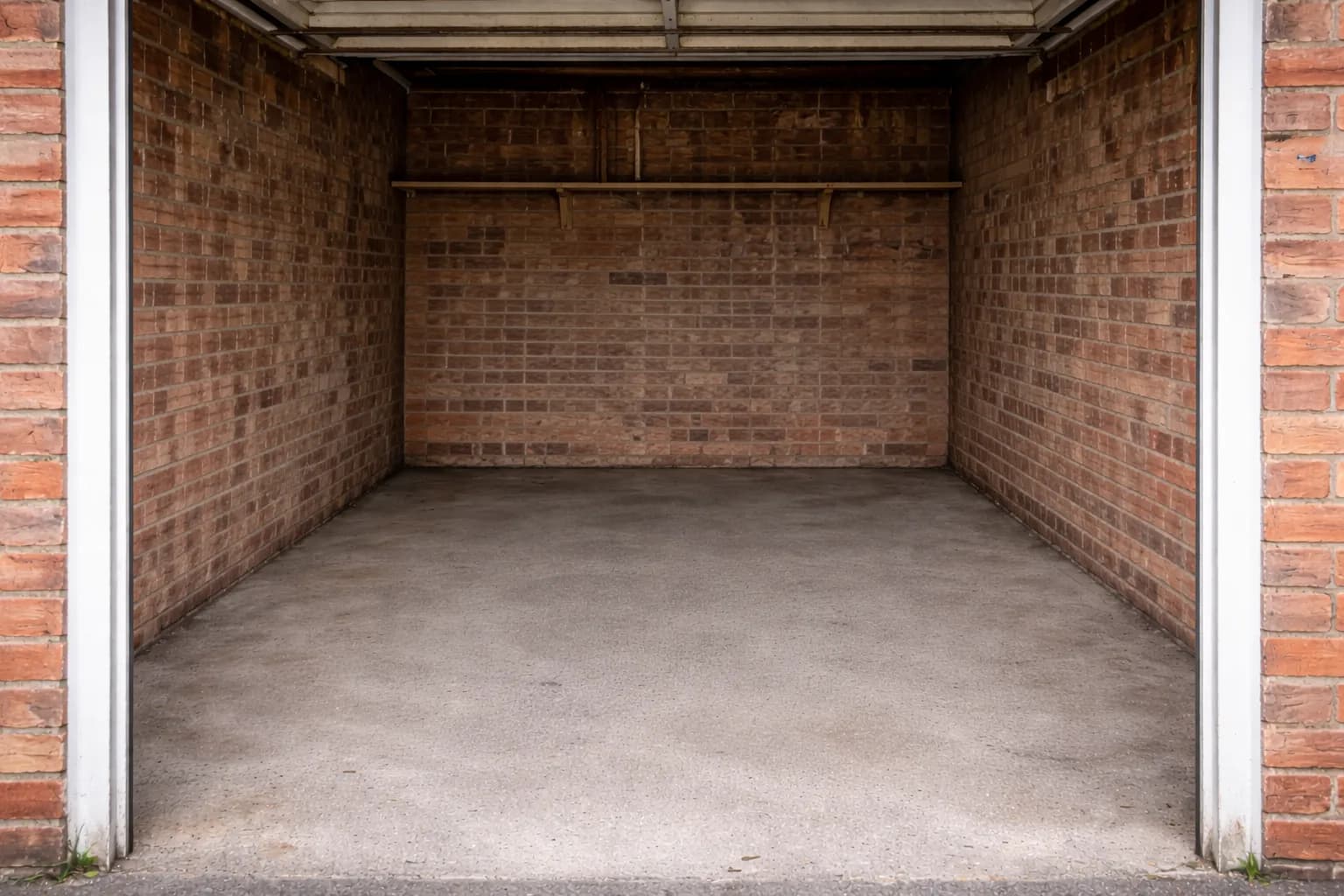 Same garage completely empty and swept clean